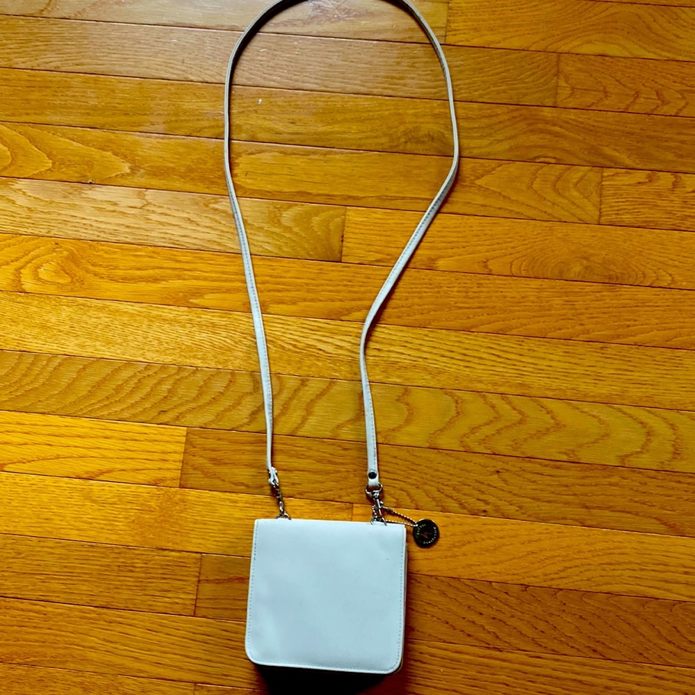 vinyl crossbody…easy to clean or get wet and 2 sides of storage as pictured